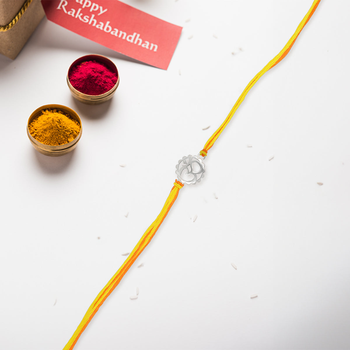 Elegant Silver Om Rakhi