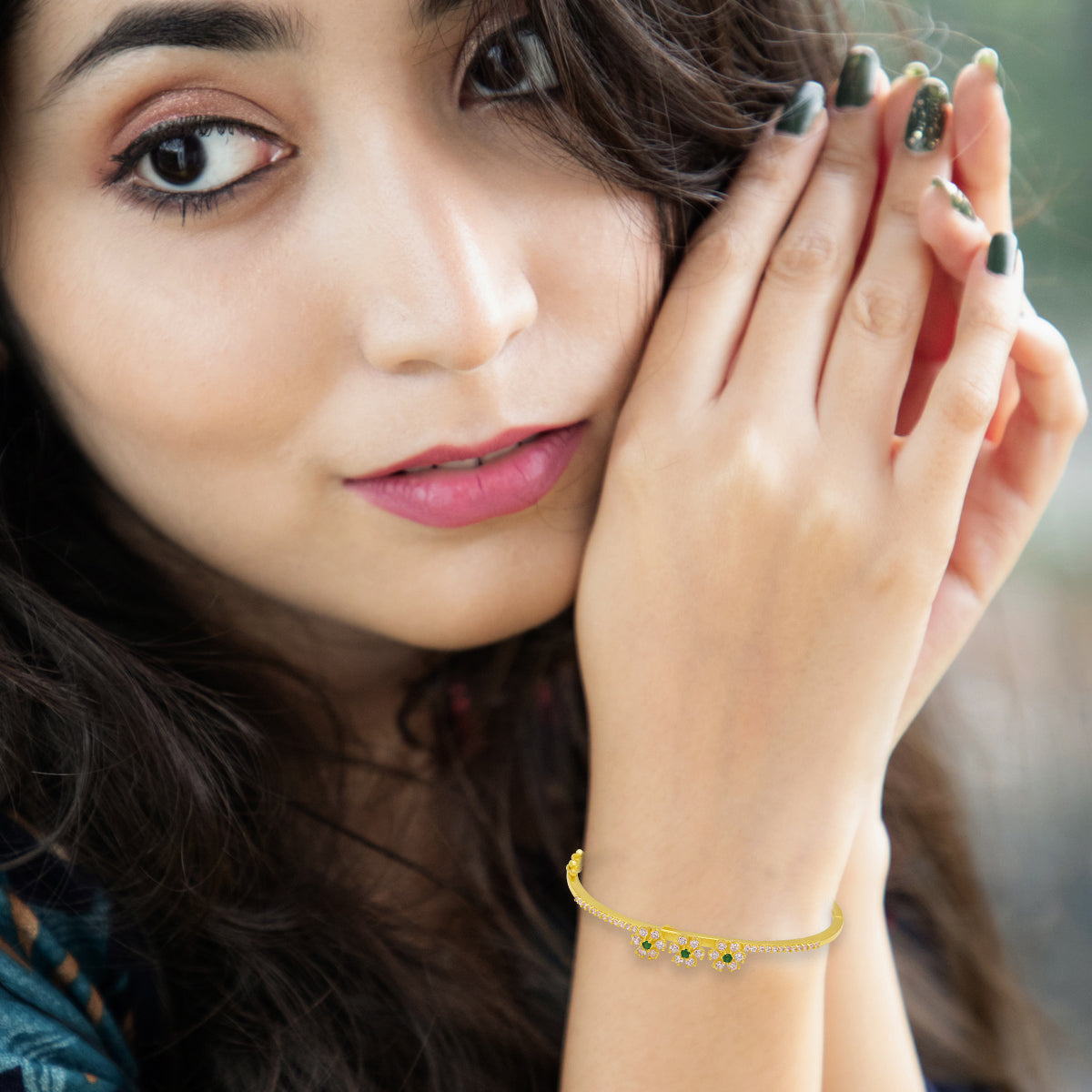 Charming Emerald-Studded Gold Plated Floral Bracelet