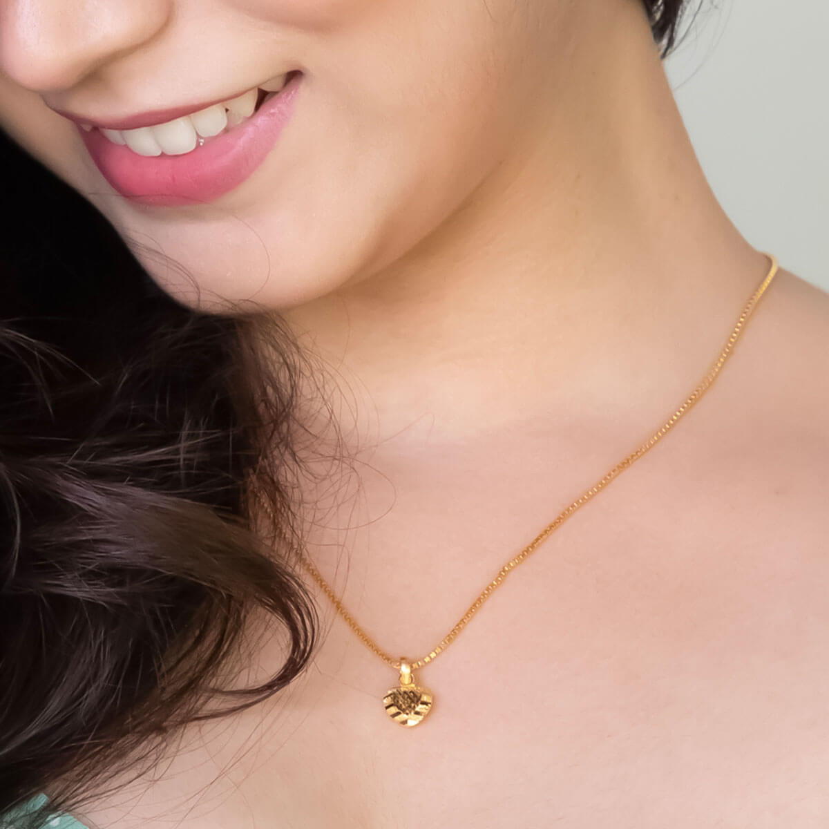 Gentle Radiance Gold Heart Pendant