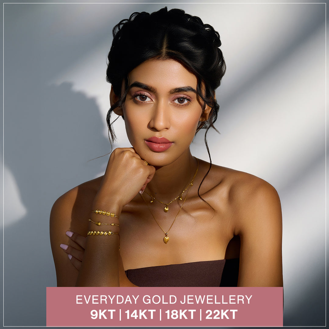 Gold Bangle with Gleaming Charm